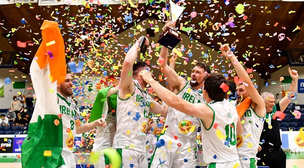 Irish players celebrate with the cup